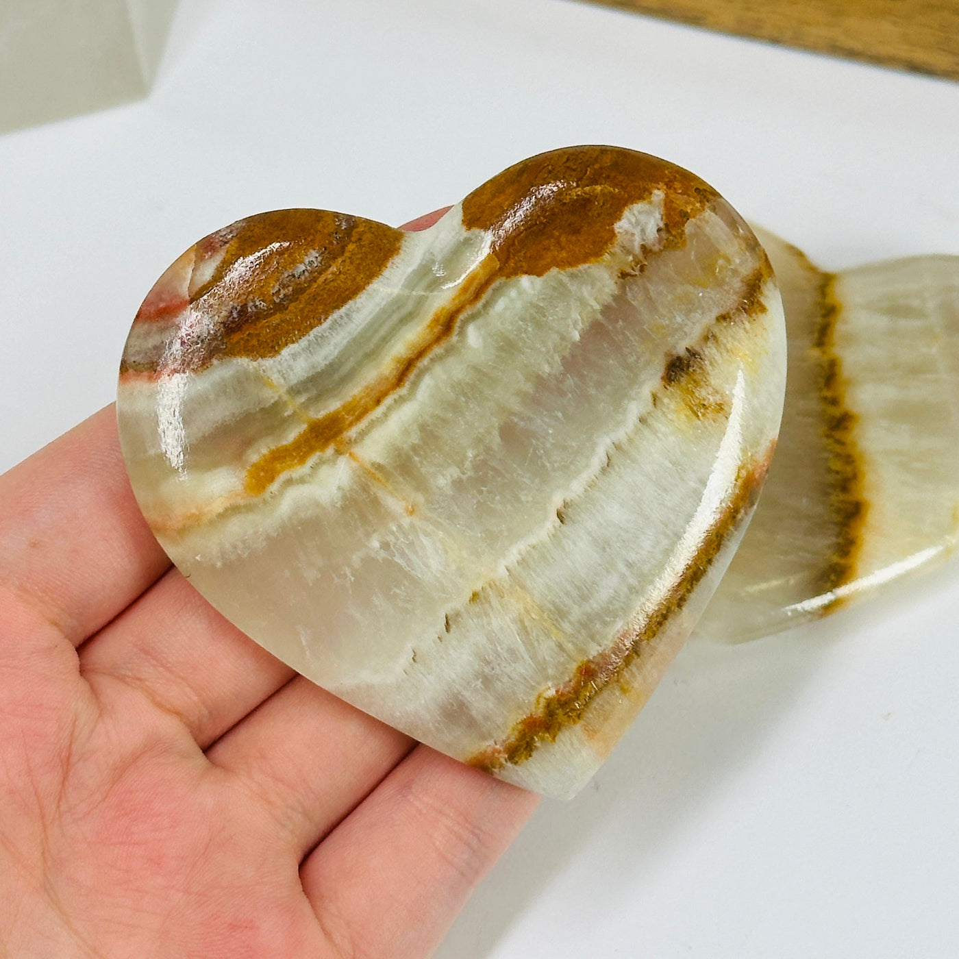 onyx heart with decorations in the background