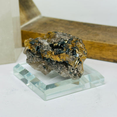 rutilated quartz with decorations in the background