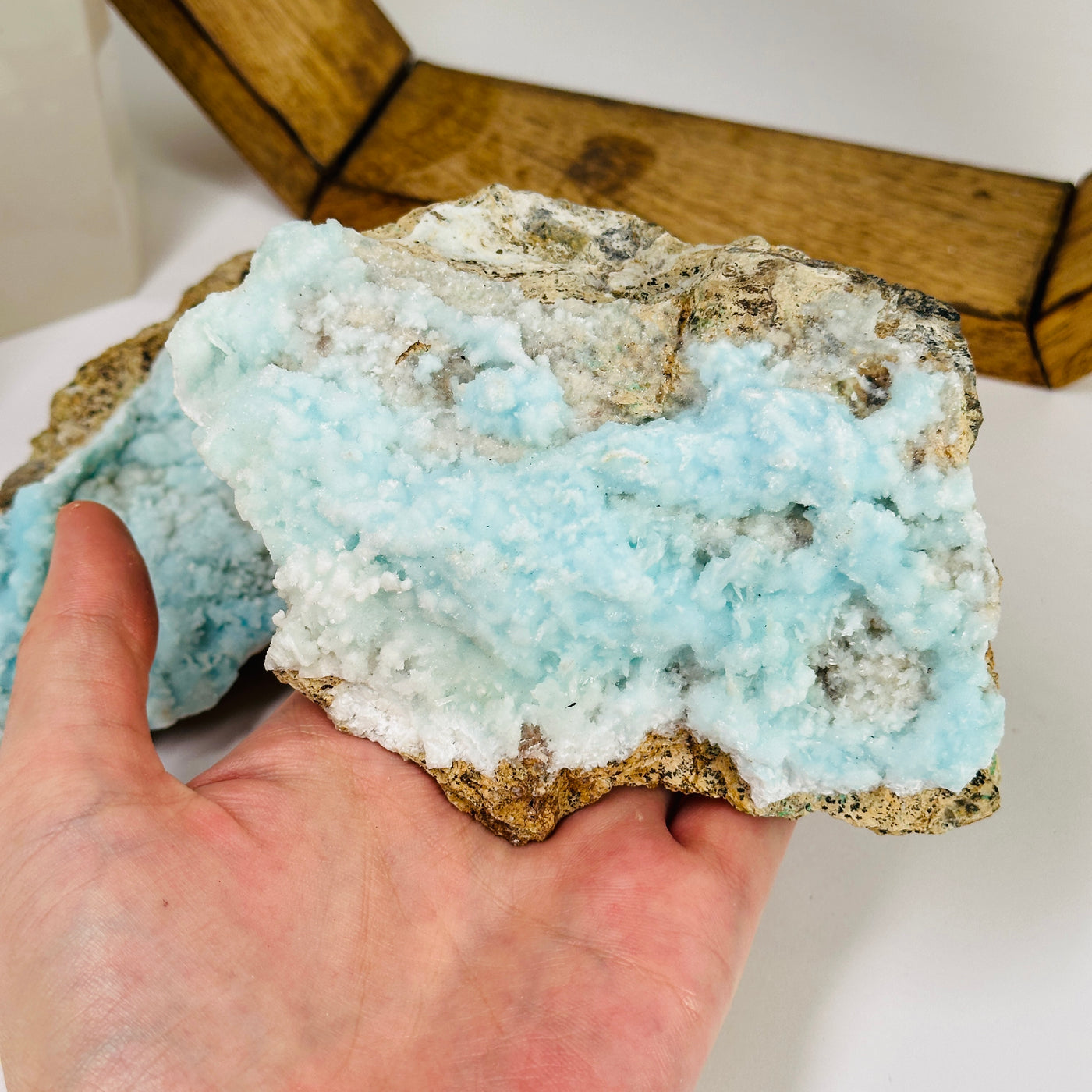 blue aragonite with decorations in the background