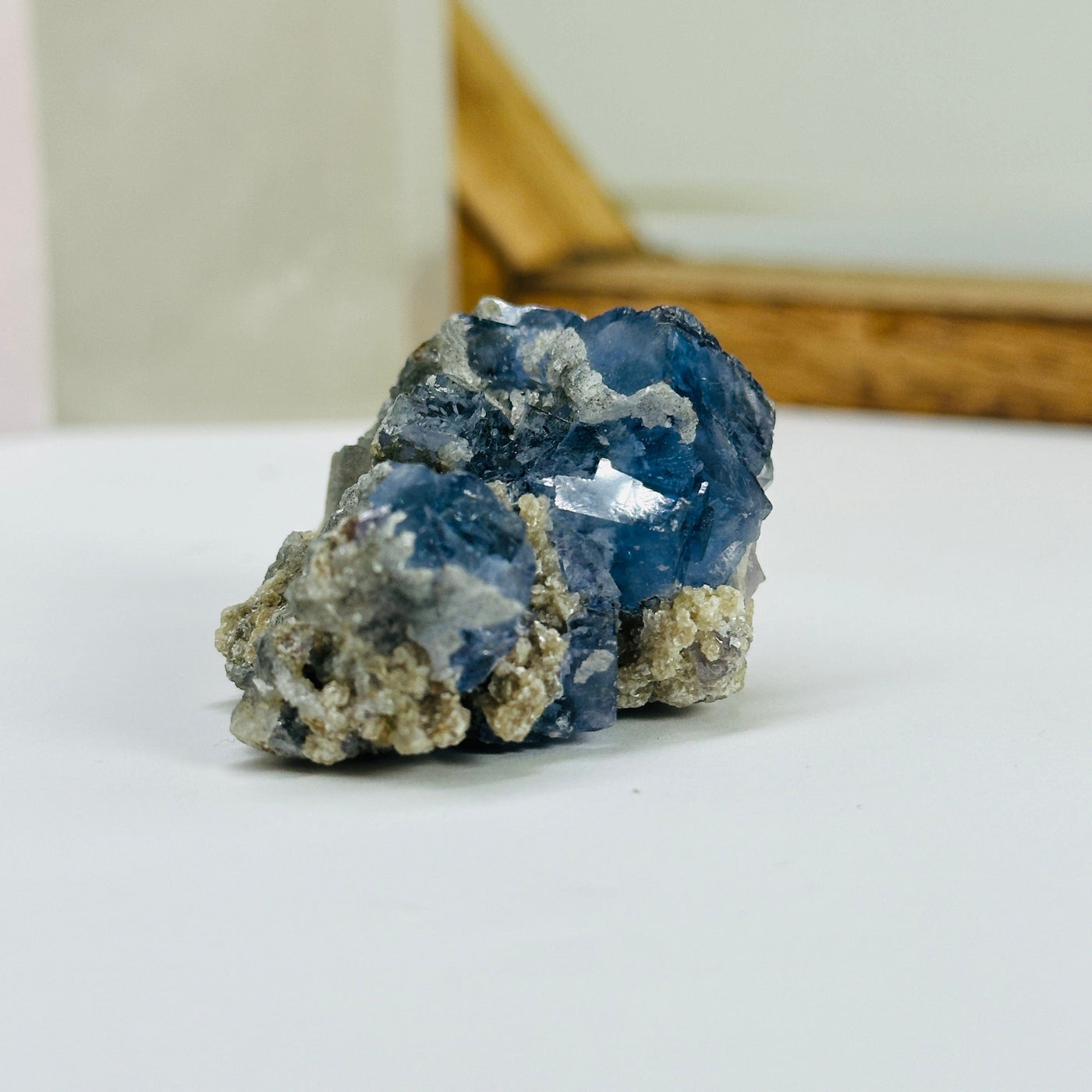 blue fluorite with decorations in the background