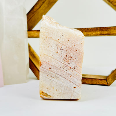 calcite cut base with decorations in the background