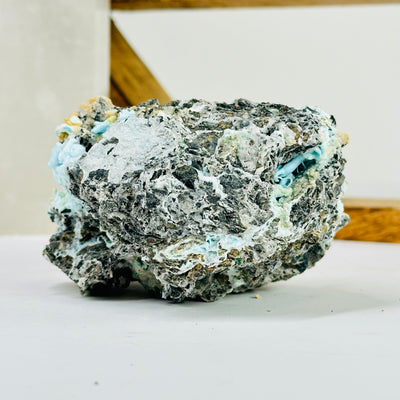 blue aragonite with decorations in the background