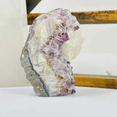 amethyst cut base with decorations in the background