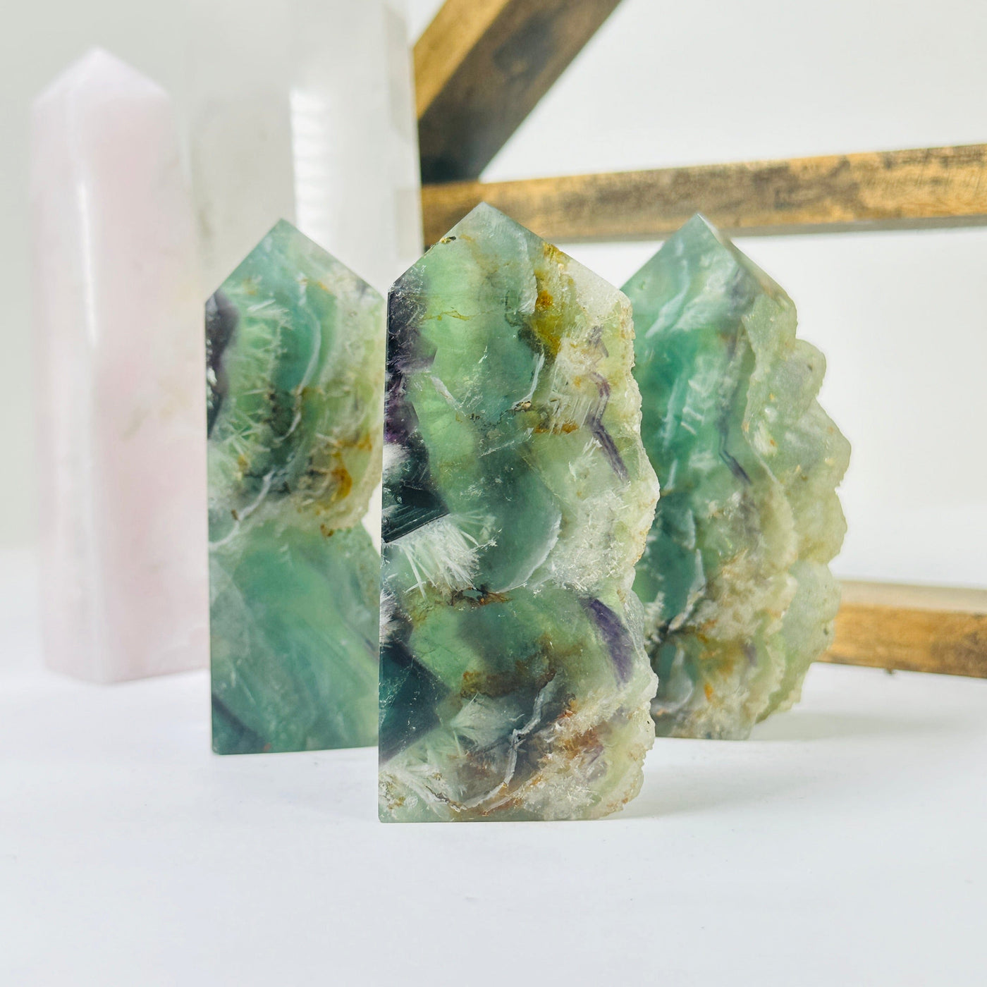 fluorite points with decorations in the background