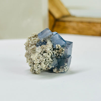 blue fluorite with decorations in the background