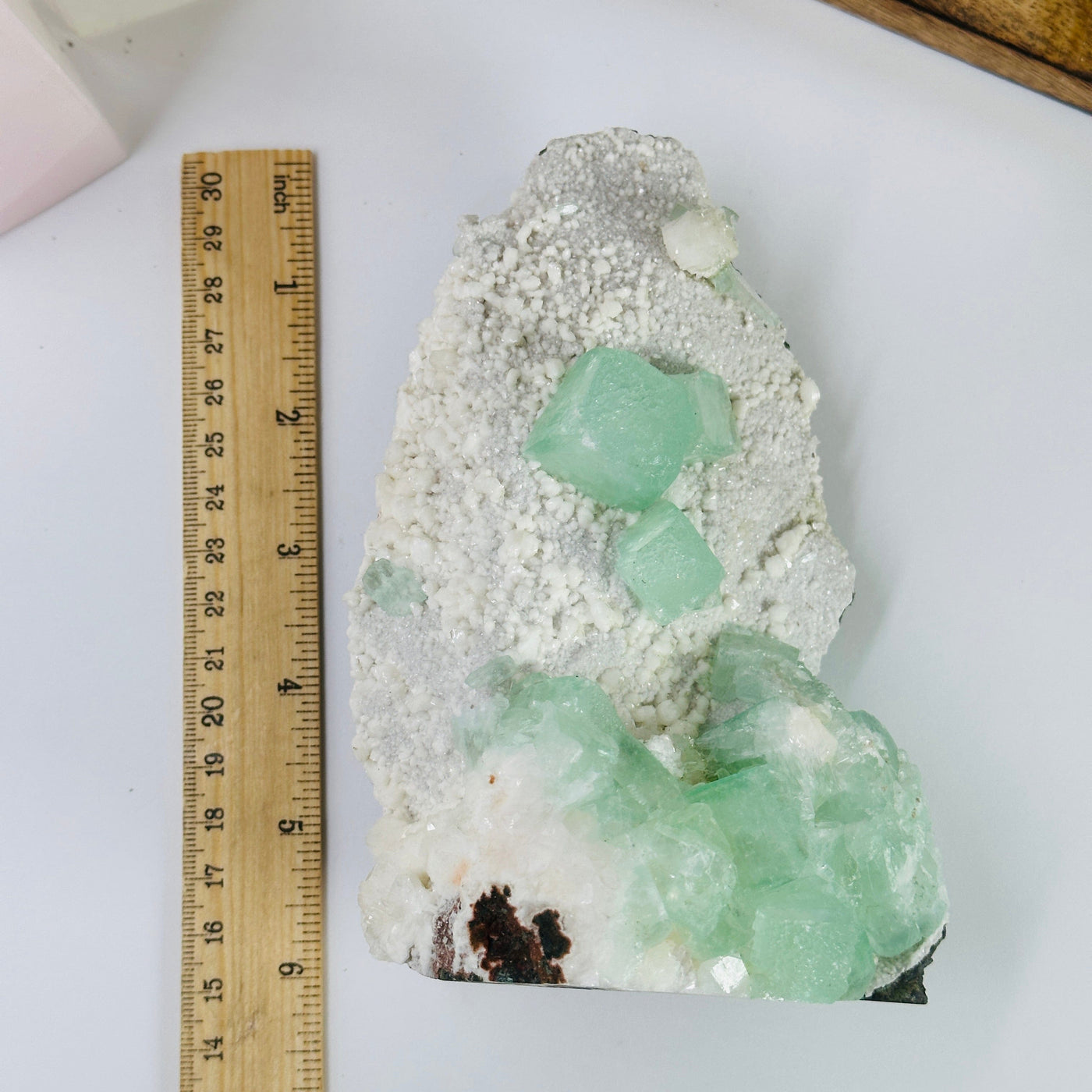 apophyllite cut base next to a ruler for size reference