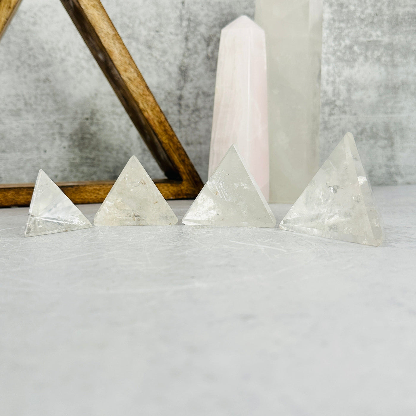 crystal quartz pyramids with decorations in the background