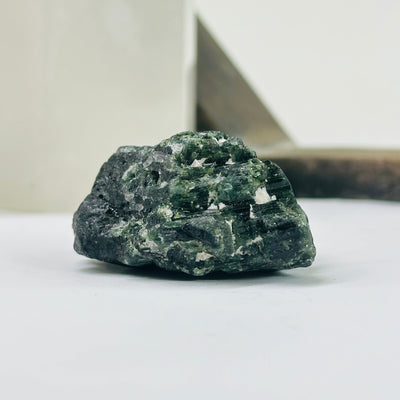 tourmaline with decorations in the background