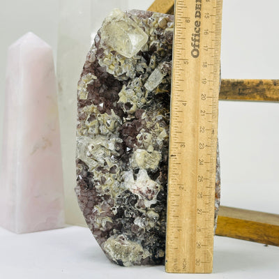 amethyst cut base next to a ruler for size reference
