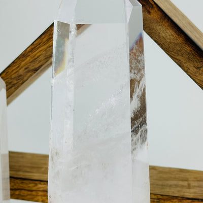 crystal quartz point with decorations in the background