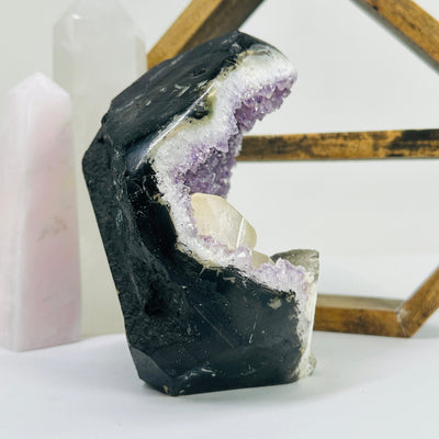 amethyst cut base with decorations in the background