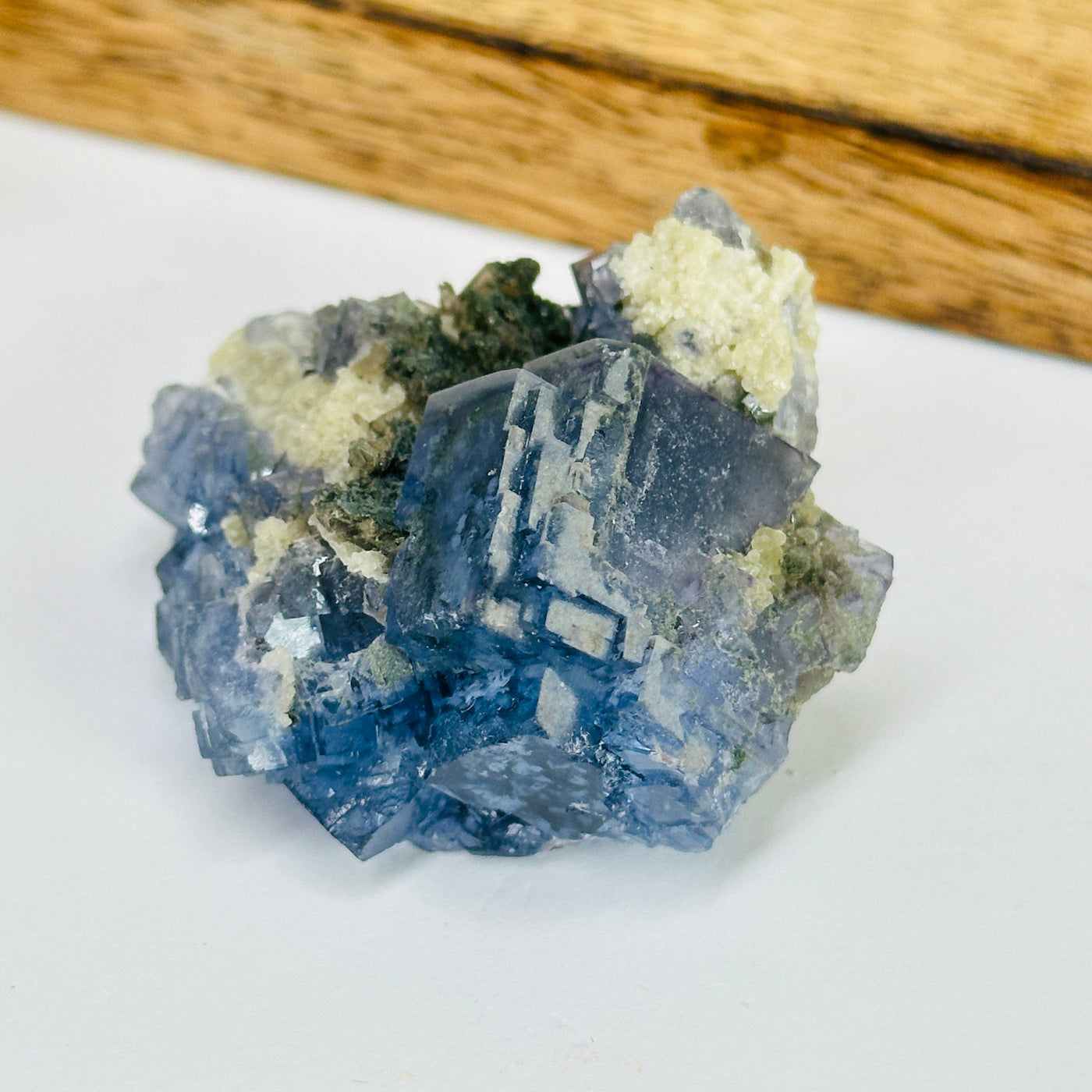 blue fluorite with decorations in the background