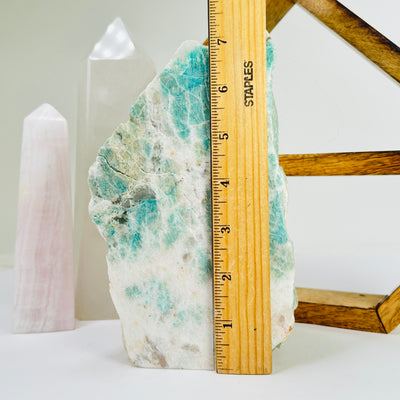 amazonite cut base next to a ruler for size reference