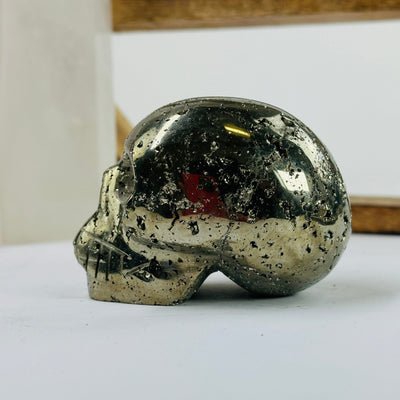 pyrite skulls with decorations in the background