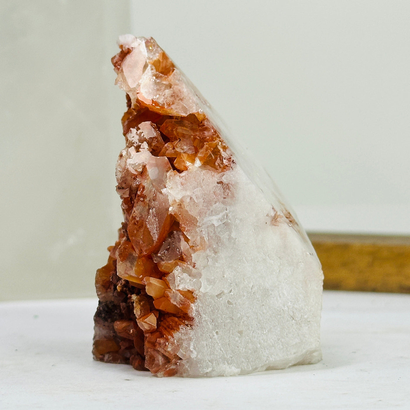 tangerine quartz points with decorations in the background