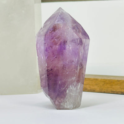 amethyst points with decorations in the background