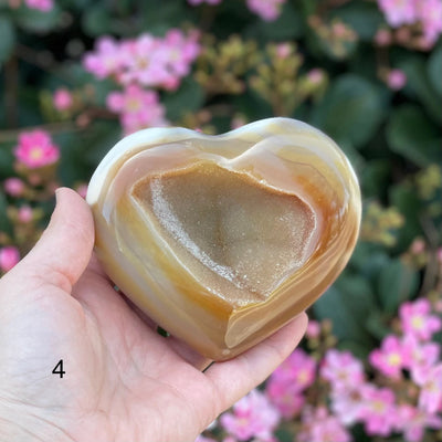 agate heart with decorations in the background