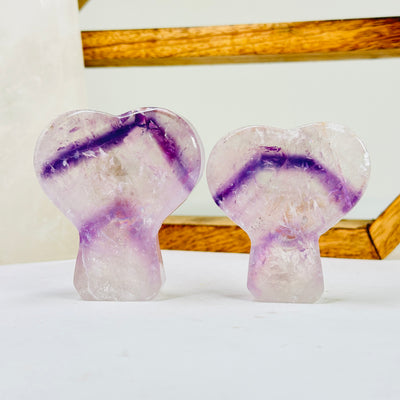 amethyst cut base with decorations in the background