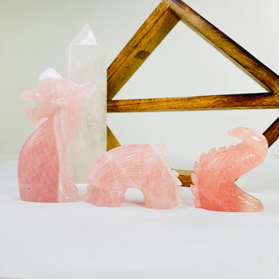 rose quartz dragon with decorations in the background