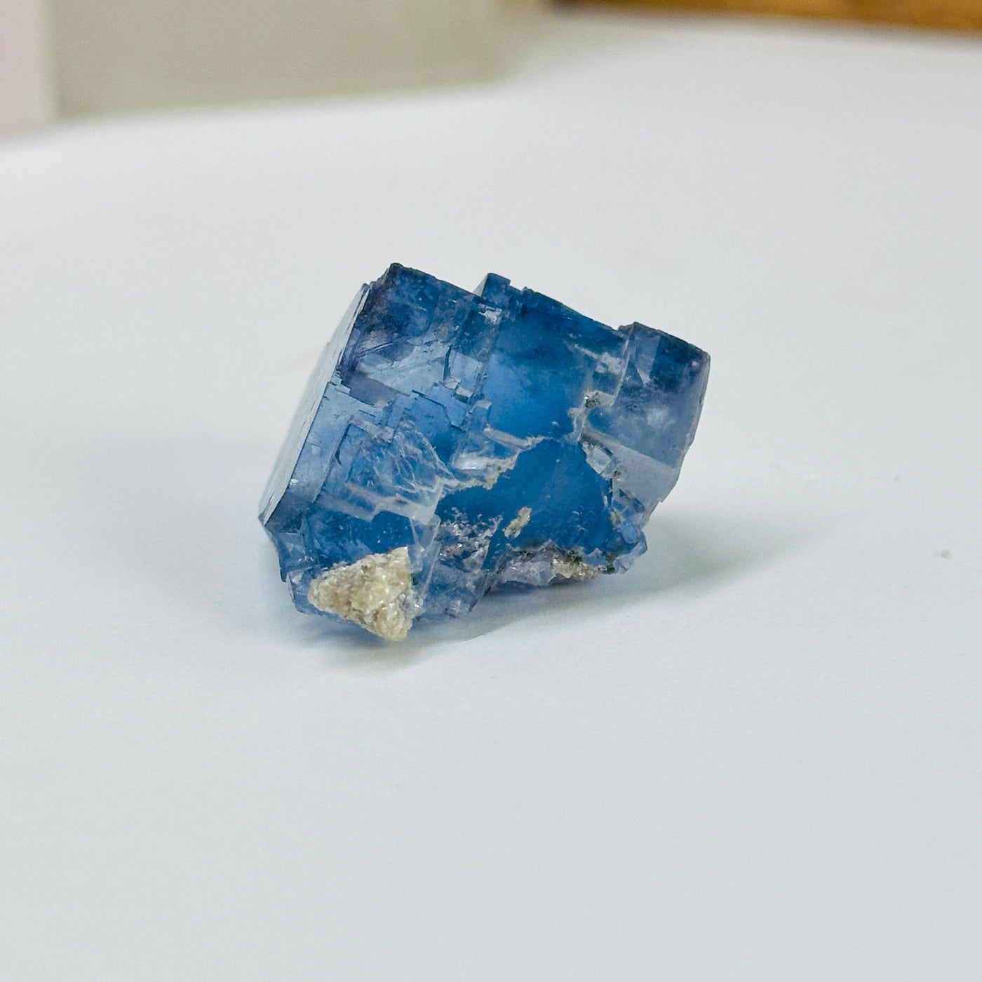 blue fluorite with decorations in the background