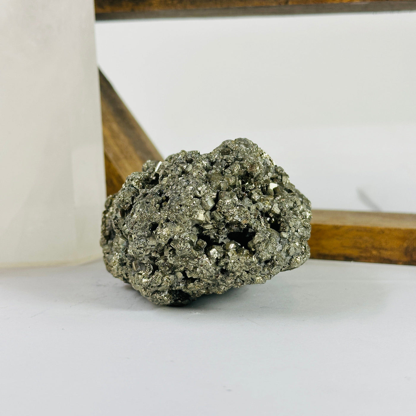 pyrite cluster with decorations in the background