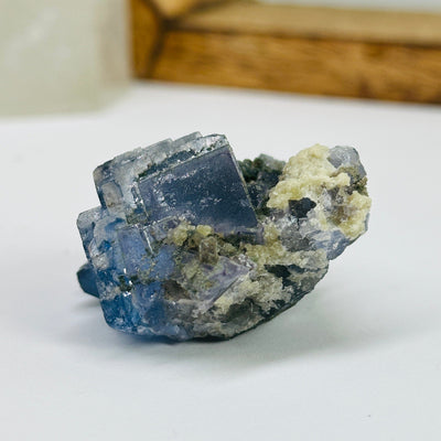 blue fluorite with decorations in the background