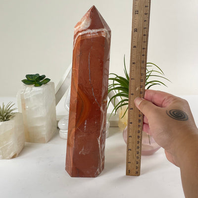 Red Jasper Crystal Obelisk with a ruler for size reference