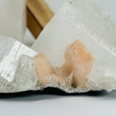 zeolite apophyllite cluster with decorations in the background