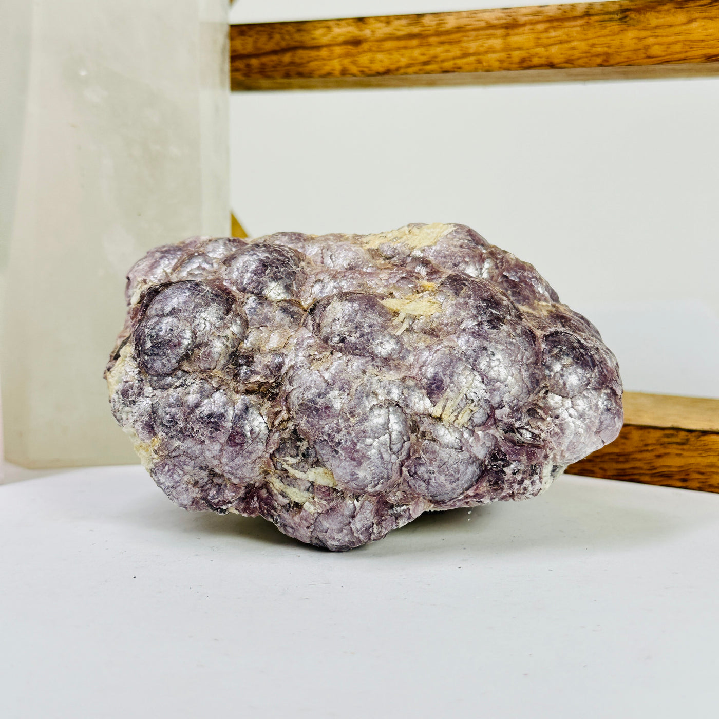 lepidolite with decorations in the background