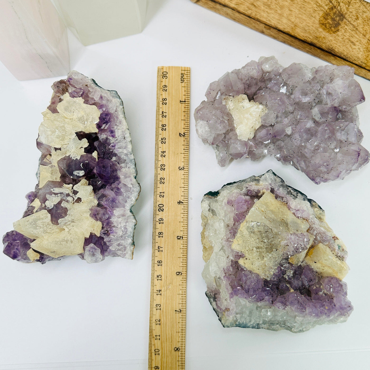 amethyst cluster next to a ruler for size reference