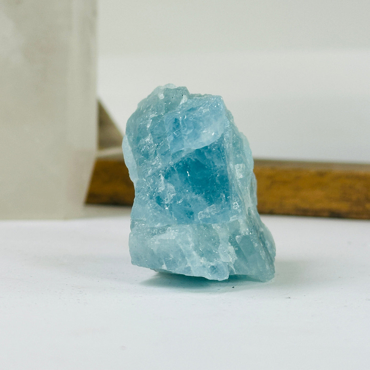 aquamarine stone with decorations in the background