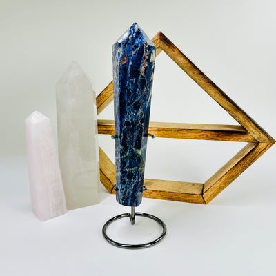 sodalite wand with decorations in the background