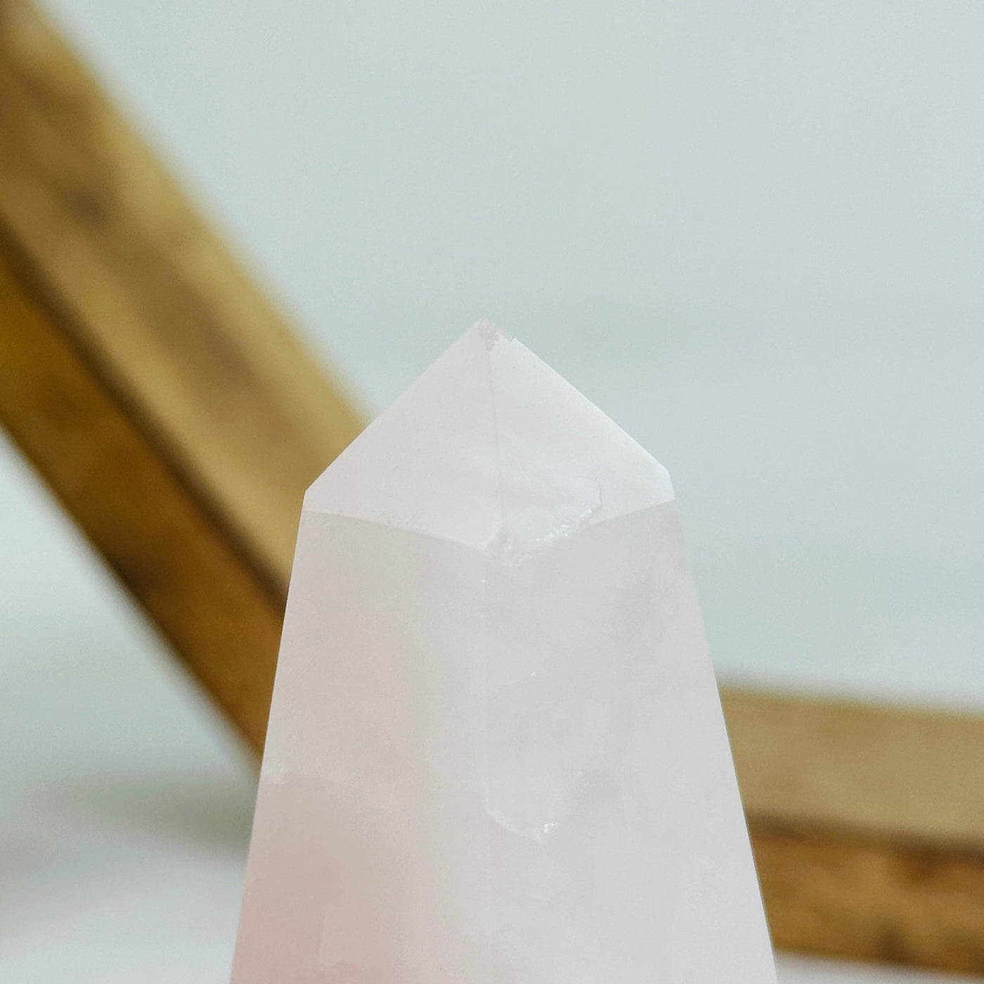 rose quartz polished tower with decorations in the background