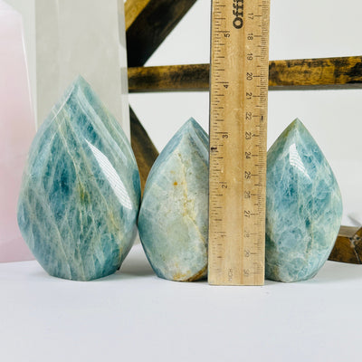 aquamarine points with decorations in the background