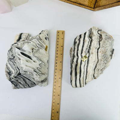 Mexican onyx cluster next to a ruler for size reference