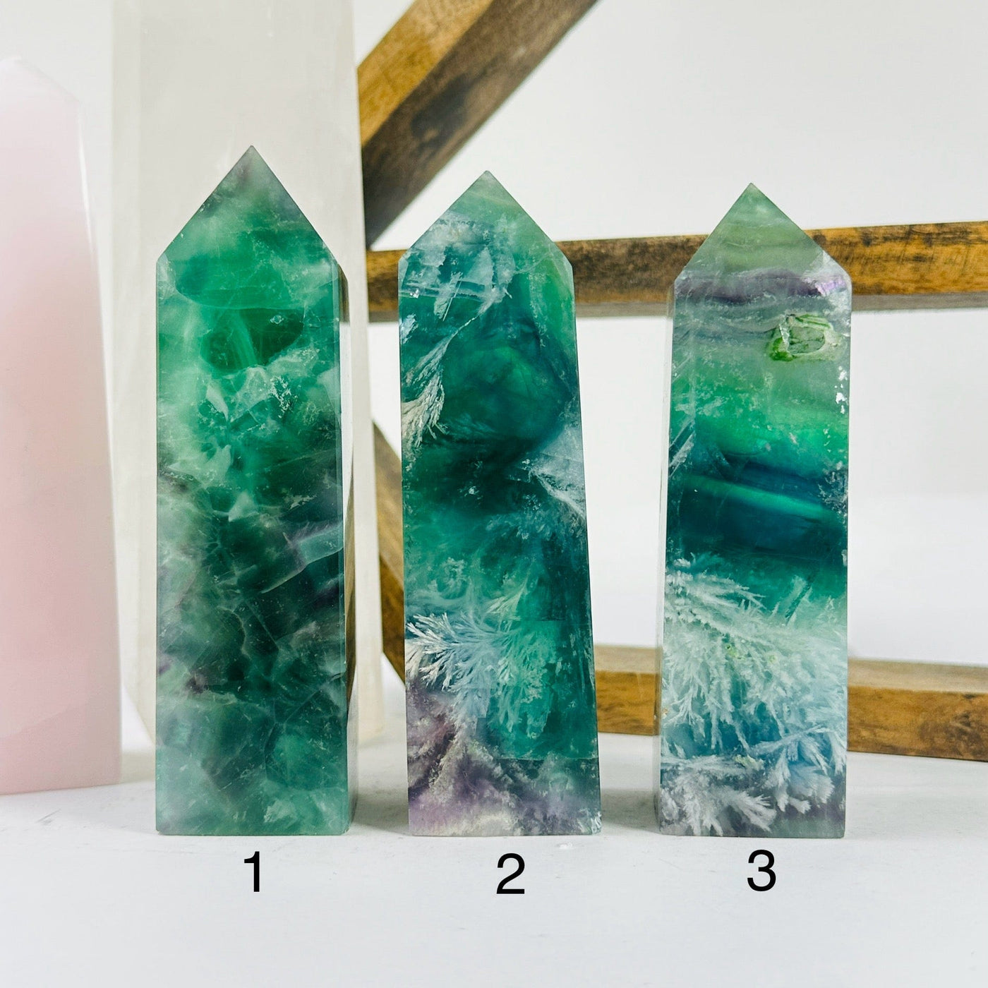 fluorite point with decorations in the background