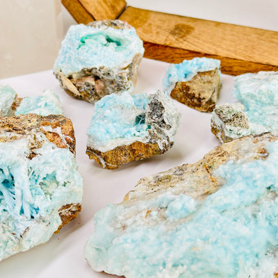 aragonite with decorations in the background