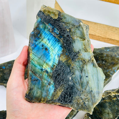 labradorite slab with decorations in the background