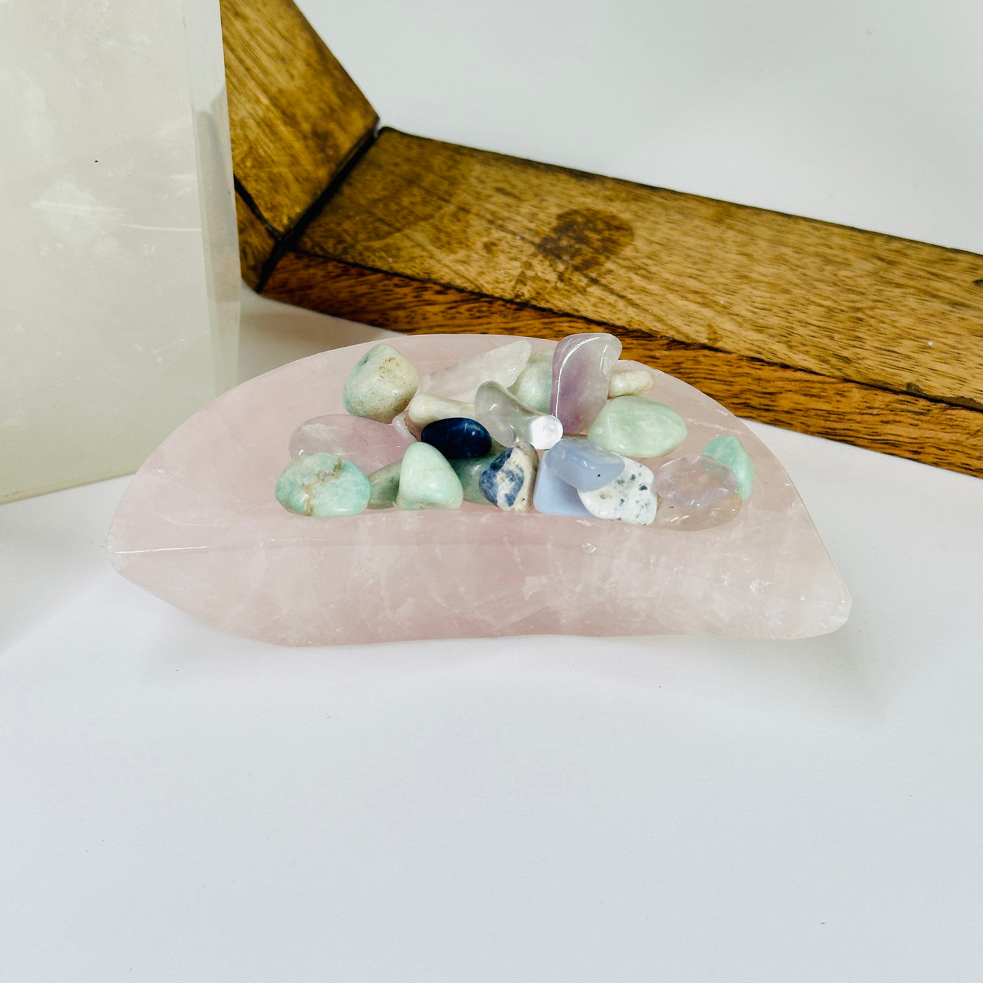 rose quartz bowl with decorations in the background