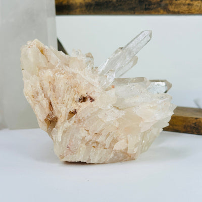 lemurian tangerine quartz with decorations in the background