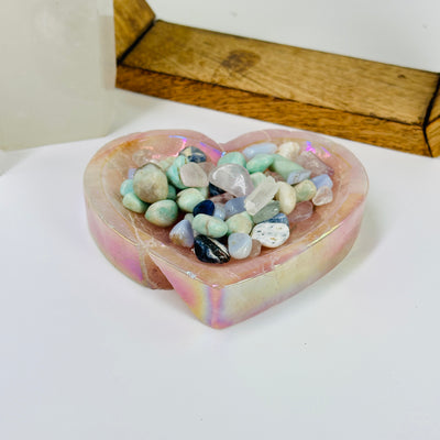 rose quartz bowl with decorations in the background