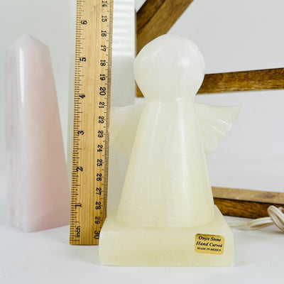 onyx angel lamp next to a ruler for size reference