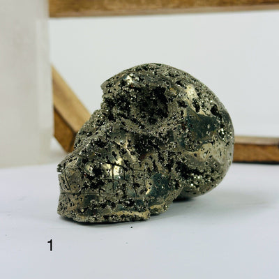 pyrite skulls with decorations in the background