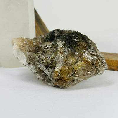 rutile quartz with decorations in the background