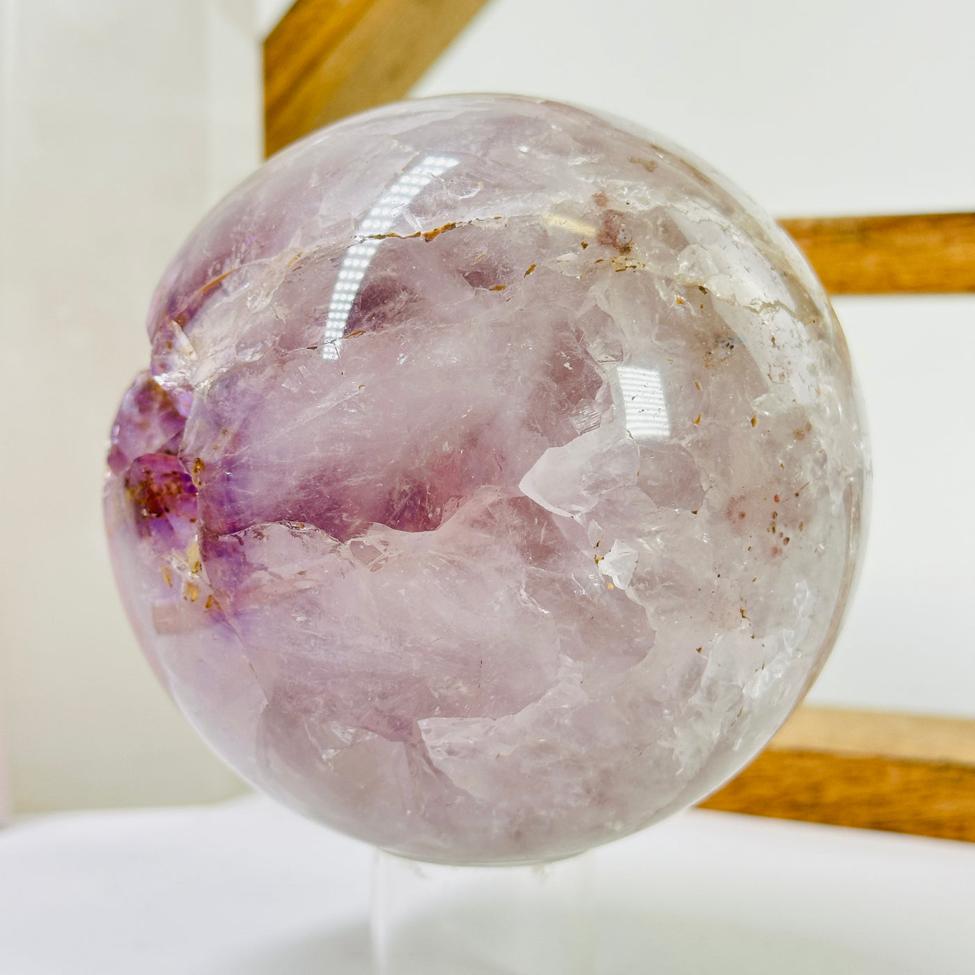 amethyst sphere with decorations in the background