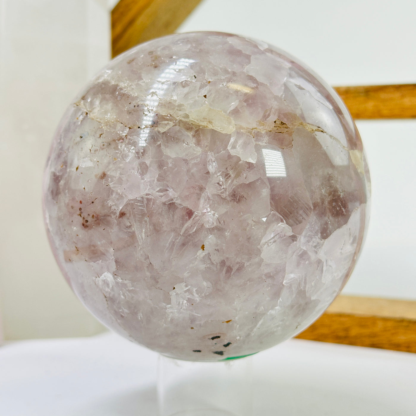 amethyst sphere with decorations in the background