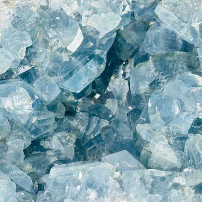 Celestite with decorations in the background