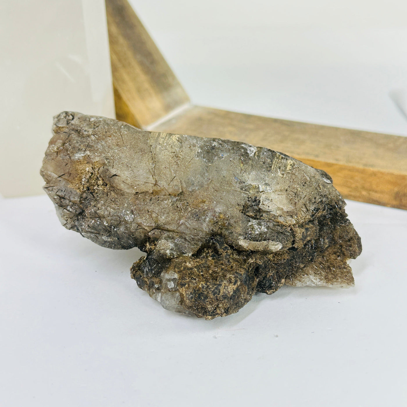 rutile quartz with decorations in the background