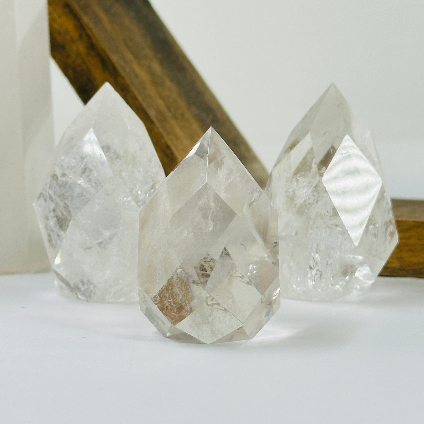 crystal quartz point with decorations in the background