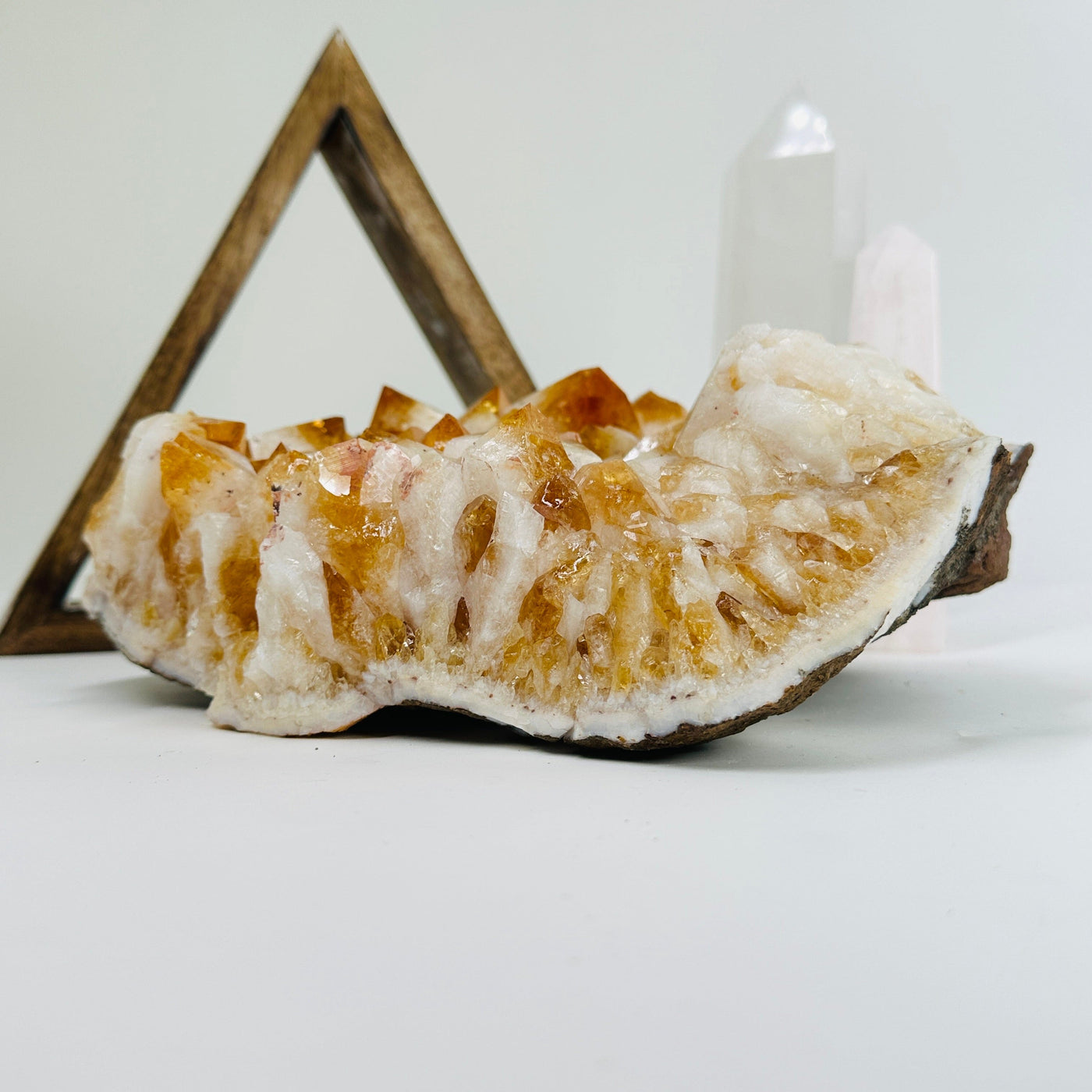 citrine cluster with decorations in the background